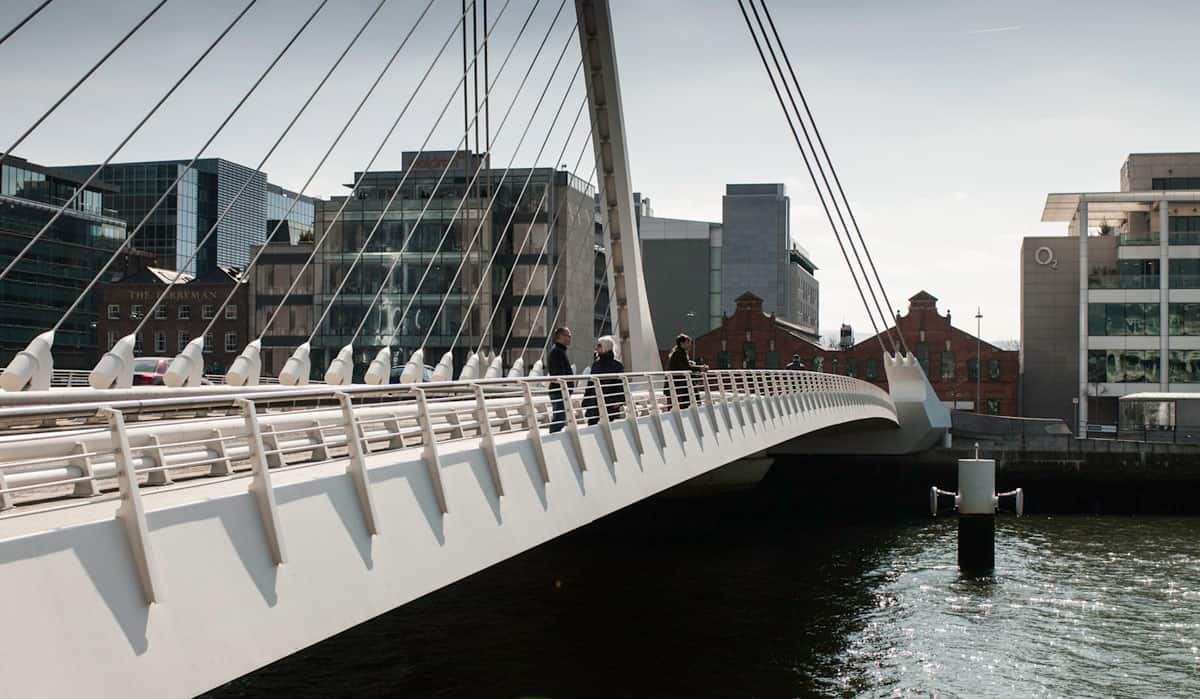 image of Dublin's grand canal bridge with a software developer standing on it