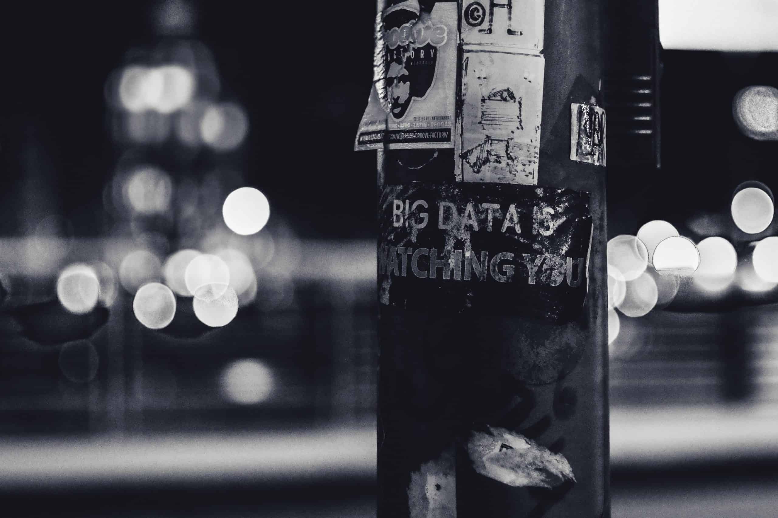black and white picture of a big data sticker in the street