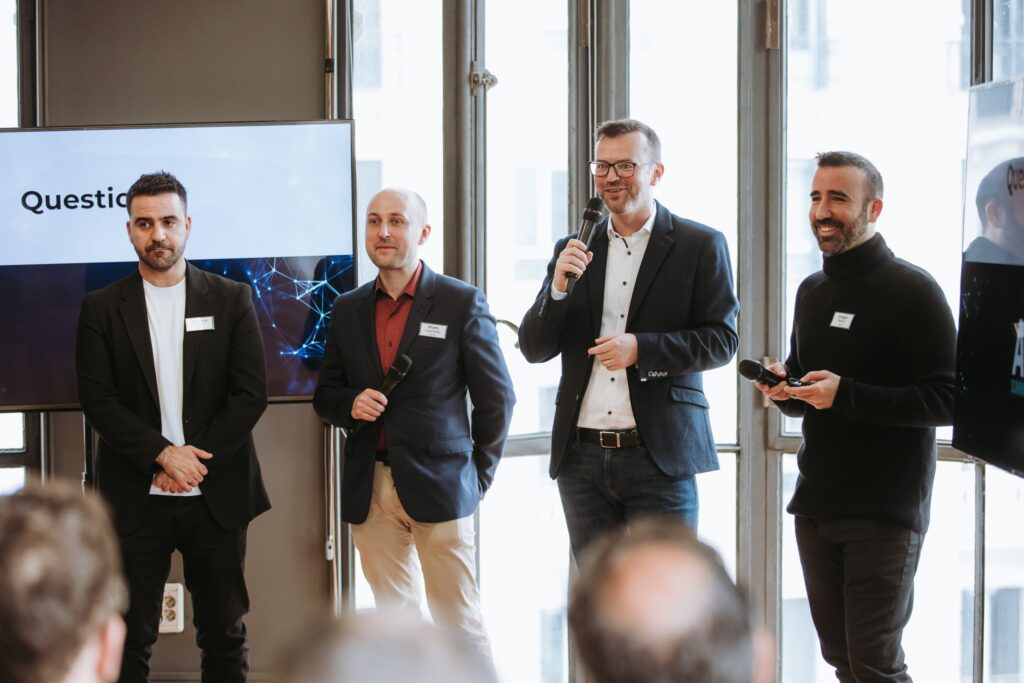 panel discussion with 4 male speakers